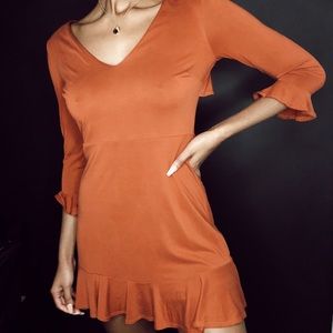 Open back orange ruffle dress